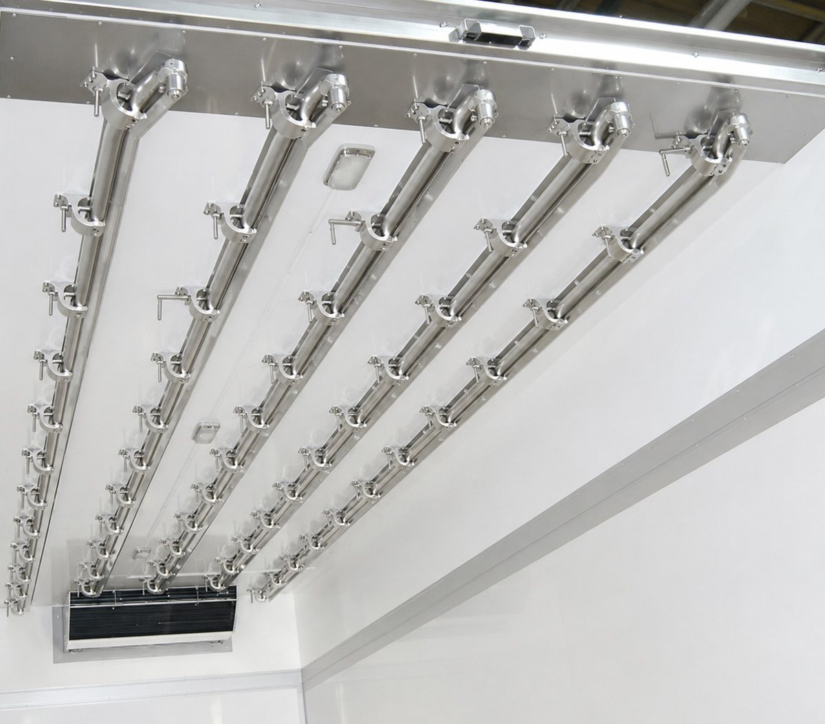 Stainless-steel meat rails in a refrigerated interior
