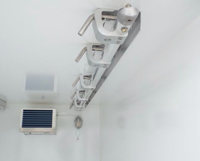 Meat rail and evaporator inside a refrigerated trailer
