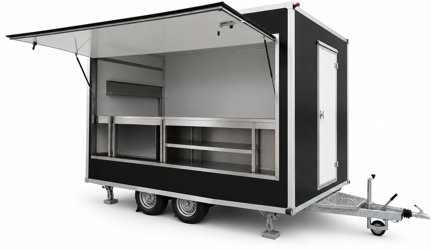 Ereste mobile shop with the serving hatch raised, stainless counters and shelving inside